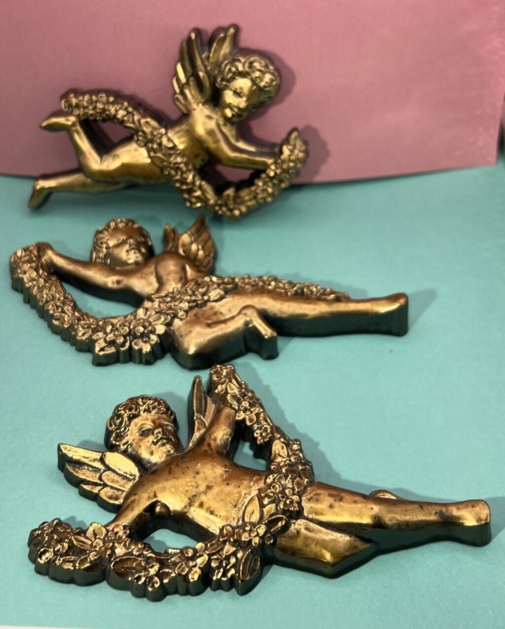 Syroco Gold-Accented Cherub Set with Lei Wall Hangings Lot of three (3)